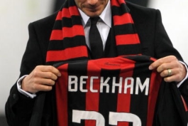 New AC Milan's midfielder David Beckham, holding his number 32 AC Milan's jersey, is presented to supporters prior the team's Italian Serie A match against Udinese December 21, 2008