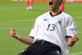 German midfielder Michael Ballack kneels on the pitch and lets out a jubilant scream after scoring the 1-0 lead during the 2002 World Cup semi-final Germany against South Korea in Seoul